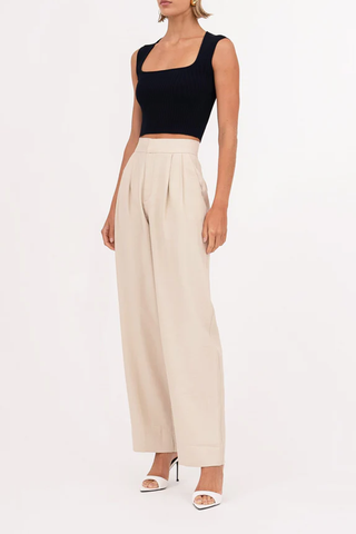 side profile model wearing Fallon Pant oat cream high waisted straight leg