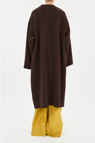 back profile model wearing Fernanda Double Faced Wool Oversized Coat with removable tie two front pockets collarless brown