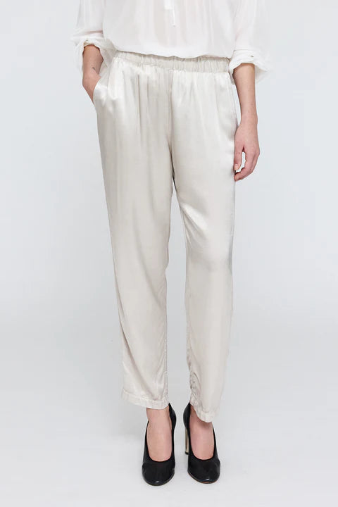front profile model wearing Fez satin silver Pant elastic waist with pockets