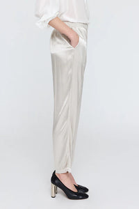 side profile model wearing Fez satin silver Pant elastic waist with pockets