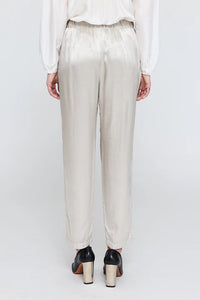 back profile model wearing Fez satin silver Pant elastic waist with pockets