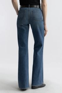 back profile model wearing Florence Jean Classic Wash mid blue Premium Japanese stretch denim
Utility design
Classic sailor pant
Mid-to-high-rise
Two flat front pockets
Flare leg