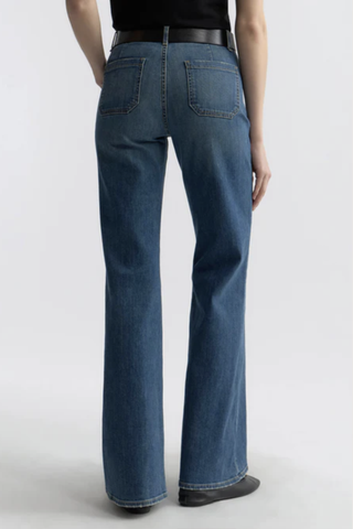 back profile model wearing Florence Jean Classic Wash mid blue Premium Japanese stretch denim
Utility design
Classic sailor pant
Mid-to-high-rise
Two flat front pockets
Flare leg