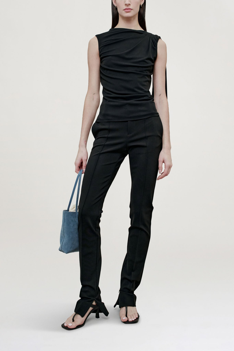 front profile model wearing  Floriana Matte Jersey Top Sleeveless top
Slinky matte jersey
Diagonal ruching across the body from a high neckline
Fitted through the torso with a long sash at the shoulder
Light internal support at chest
100% Viscose