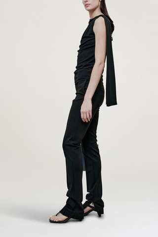side profile model wearing  Floriana Matte Jersey Top Sleeveless top
Slinky matte jersey
Diagonal ruching across the body from a high neckline
Fitted through the torso with a long sash at the shoulder
Light internal support at chest
100% Viscose