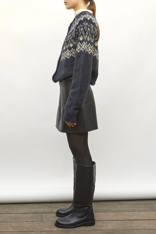 side profile model wearing Foil Mini Skirt deep black Leather-look knit
Short milano knit skirt
Coated leather effect
Flared cut
Back zipper