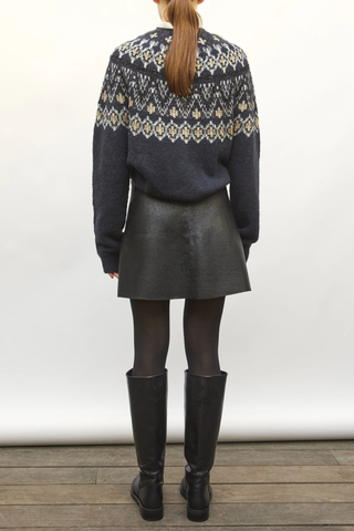 back profile model wearing Foil Mini Skirt deep black Leather-look knit
Short milano knit skirt
Coated leather effect
Flared cut
Back zipper
