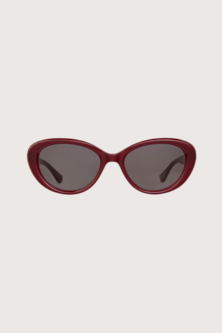 front profile GLCO x Doen Ingenue Sun Lipstick red frame  dark grey lens Thicker, more expressive cat-eye