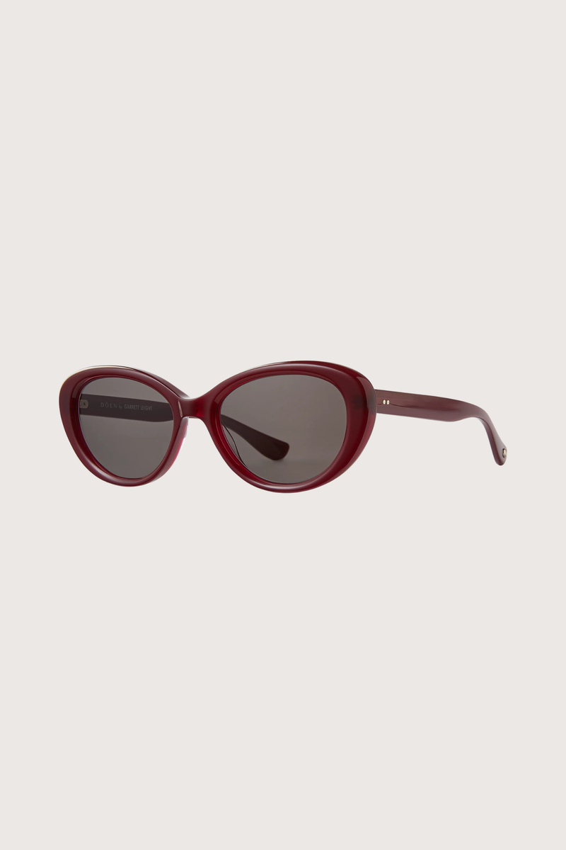 angled profile GLCO x Doen Ingenue Sun Lipstick red frame  dark grey lens Thicker, more expressive cat-eye