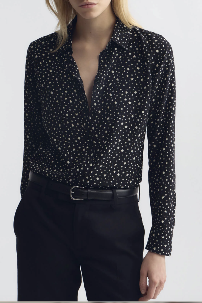 front profile model wearing  Gaia Star Print Shirt black white Long sleeve
Collared
Button up
Straight, slim body
Back yoke
Star print throughout
Classic placket details
100% Silk