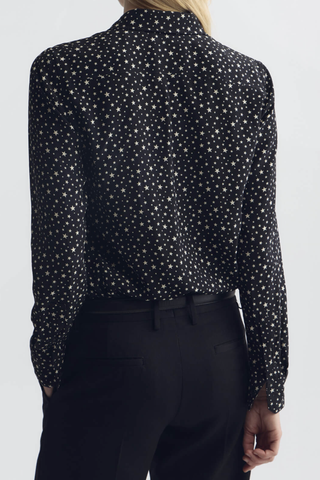 back profile model wearing  Gaia Star Print Shirt black white Long sleeve
Collared
Button up
Straight, slim body
Back yoke
Star print throughout
Classic placket details
100% Silk