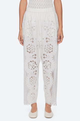 front profile model wearing Gardener Embroidered Pants white Floral embroidery throughout
Sheer side panels
Delicate cutout detailing
Elasticized waistband
Softly tapered silhouette cotton nylon polyester blend