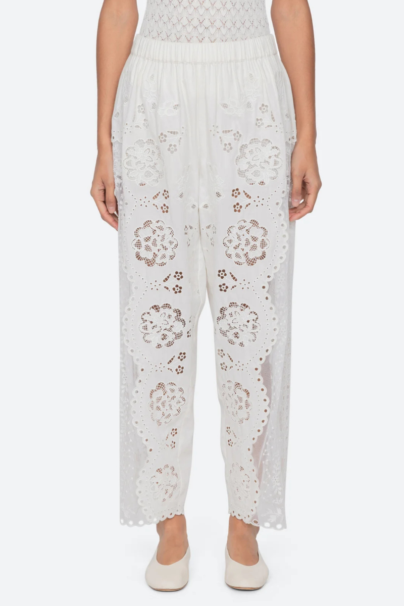 front profile model wearing Gardener Embroidered Pants white Floral embroidery throughout
Sheer side panels
Delicate cutout detailing
Elasticized waistband
Softly tapered silhouette cotton nylon polyester blend