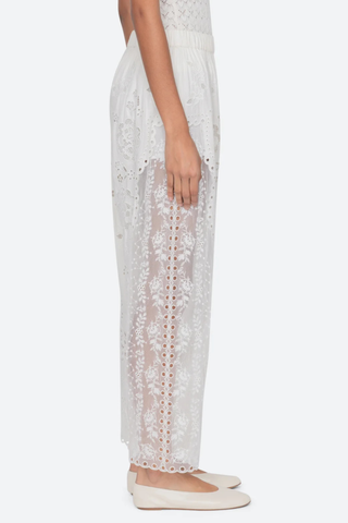 side profile model wearing Gardener Embroidered Pants white Floral embroidery throughout
Sheer side panels
Delicate cutout detailing
Elasticized waistband
Softly tapered silhouette cotton nylon polyester blend