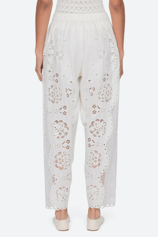 back profile model wearing Gardener Embroidered Pants white Floral embroidery throughout
Sheer side panels
Delicate cutout detailing
Elasticized waistband
Softly tapered silhouette cotton nylon polyester blend