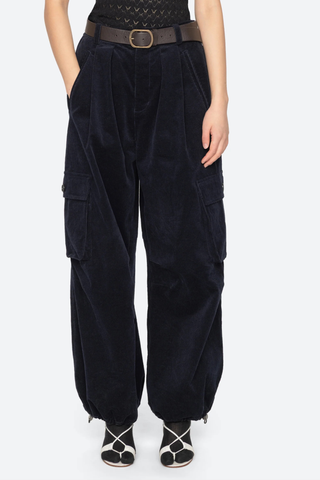 front profile model wearing Garrett Pants navy Relaxed cargo-inspired silhouette
Finished with a removable leather belt
Adjustable drawstring hems
Side pockets with button closure
98% cotton, 2% spandex
Button and zipper closure
Relaxed fit
Slim waist