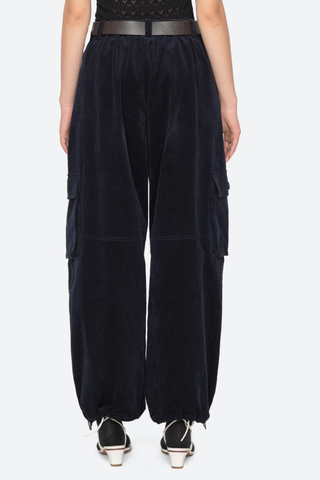 back profile model wearing Garrett Pants navy Relaxed cargo-inspired silhouette
Finished with a removable leather belt
Adjustable drawstring hems
Side pockets with button closure
98% cotton, 2% spandex
Button and zipper closure
Relaxed fit
Slim waist