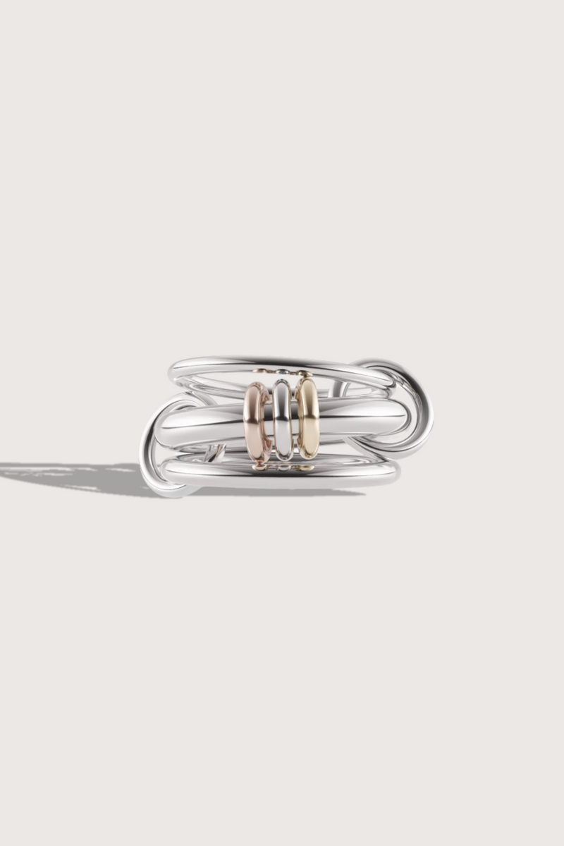 flat lay Gemini SG Ring Three linked rings in sterling silver with mixed metal accents and silver connectors