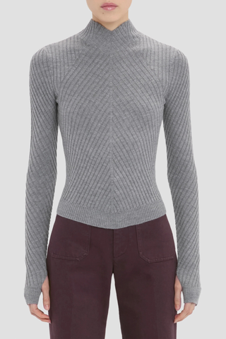 front profile model wearing Georgia Sweater grey marl Ribbed 
Tonal VB tab on the back neck
High Neck & high hip length
Fine merino wool in rib stich
VB embroidered logo
100% Merino Wool