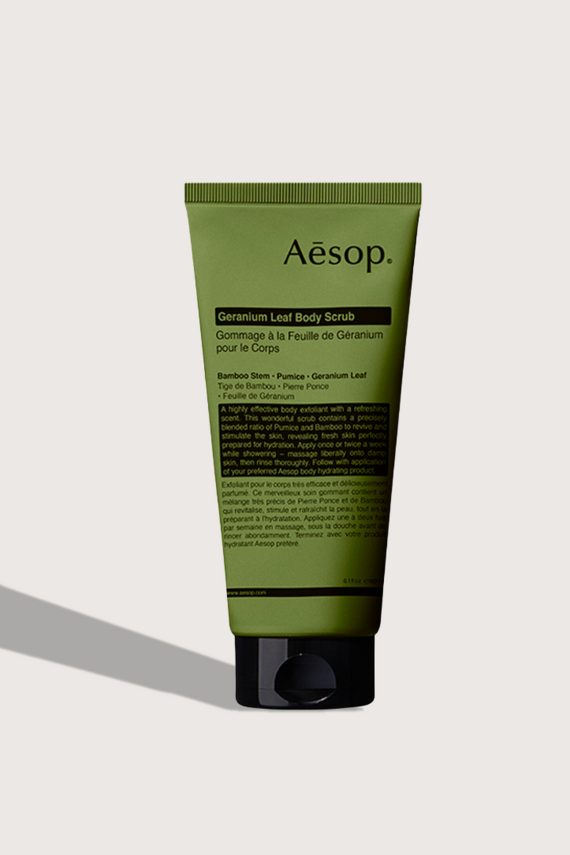 flat lay Geranium Leaf Body Scrub 180 mL green tube with cap