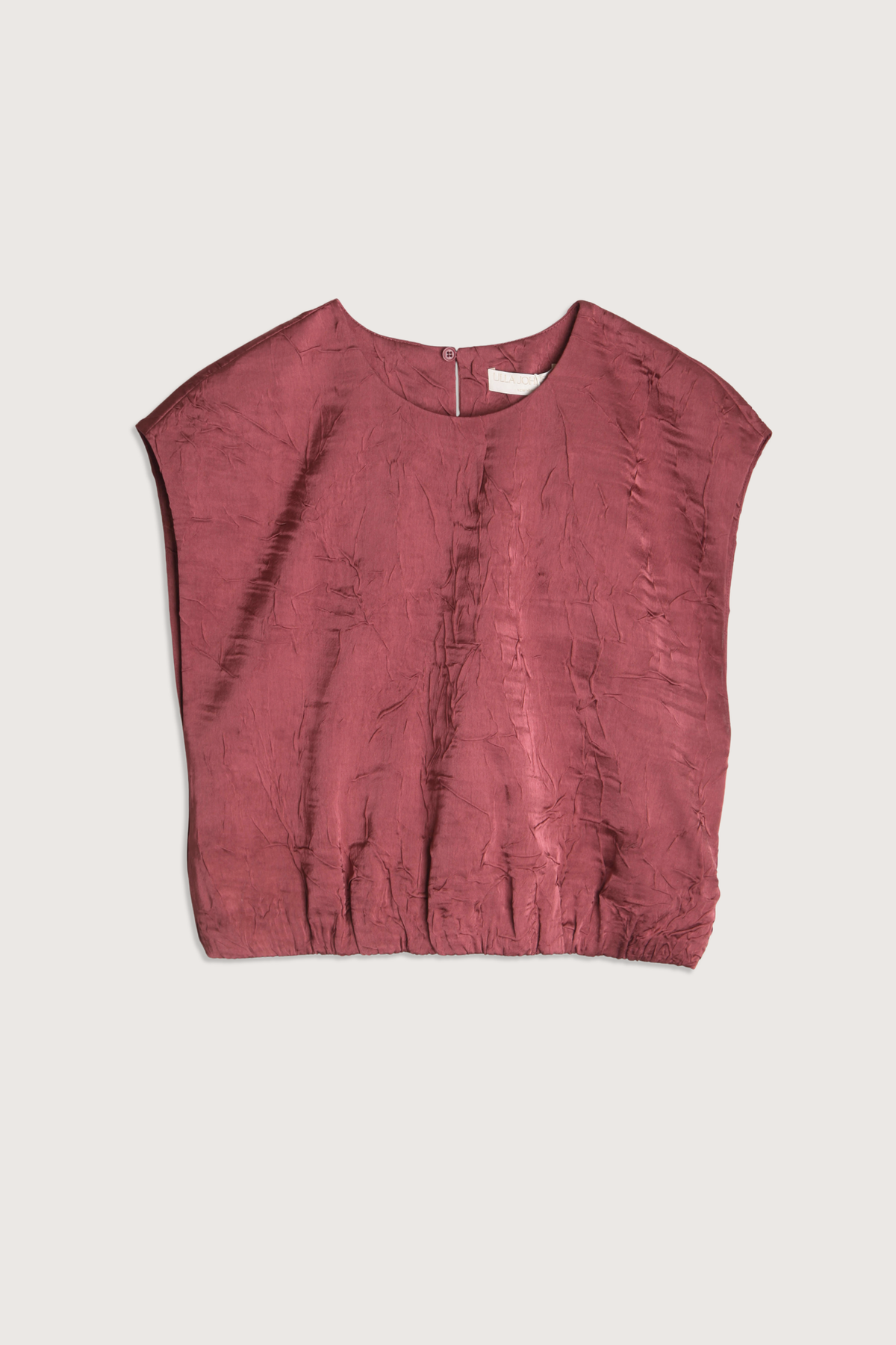 flat lay Gisella Crinkled Crop Top fig Italian crinkled satin elastic hem
Round neckline
Sleeveless
Button keyhole at back