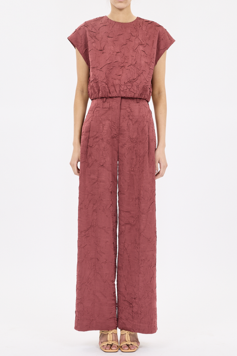 front profile model wearing  Gisella Crinkled Crop Top fig Italian crinkled satin elastic hem
Round neckline
Sleeveless
Button keyhole at back