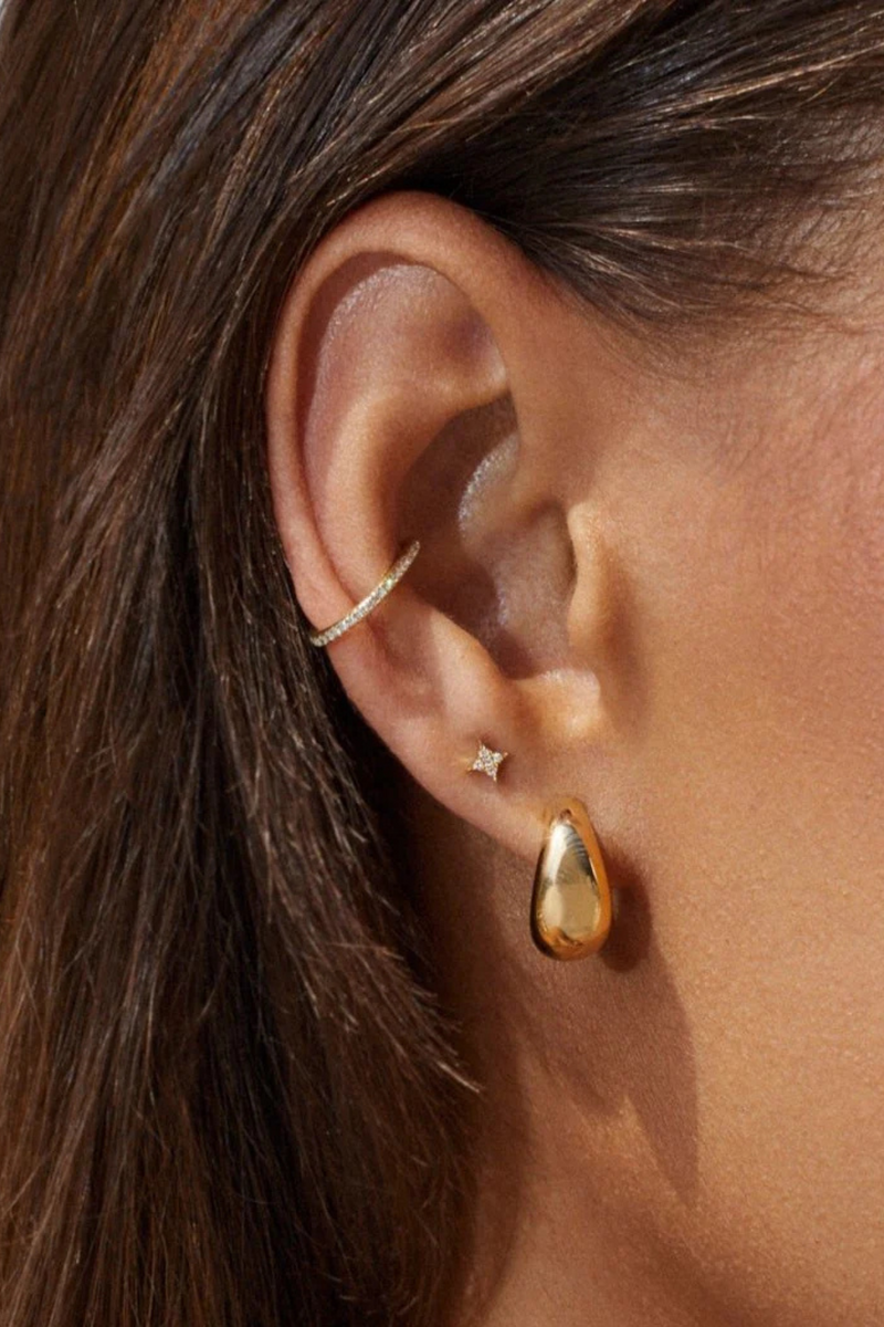 model wearing Gold Jumbo Dome HUGGIE Earring hollow 14k yellow gold