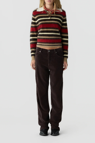 front profile model wearing Grizzly Cropped Rugby Polo carmine reg camel brown stripe combo  Rugby style
Knit from light-weight 100% cashmere
Cropped fit
Light-weight grizzly
Rib polo collar
Three button hidden half placket
Rib cuffs
