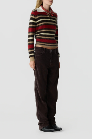 side profile model wearing Grizzly Cropped Rugby Polo carmine reg camel brown stripe combo  Rugby style
Knit from light-weight 100% cashmere
Cropped fit
Light-weight grizzly
Rib polo collar
Three button hidden half placket
Rib cuffs
