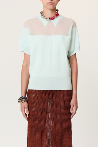 front profile model wearing Intarsia Crew Neck Top powder blue intarrsia crew neck knit
Short sleeves
Ribbed hem