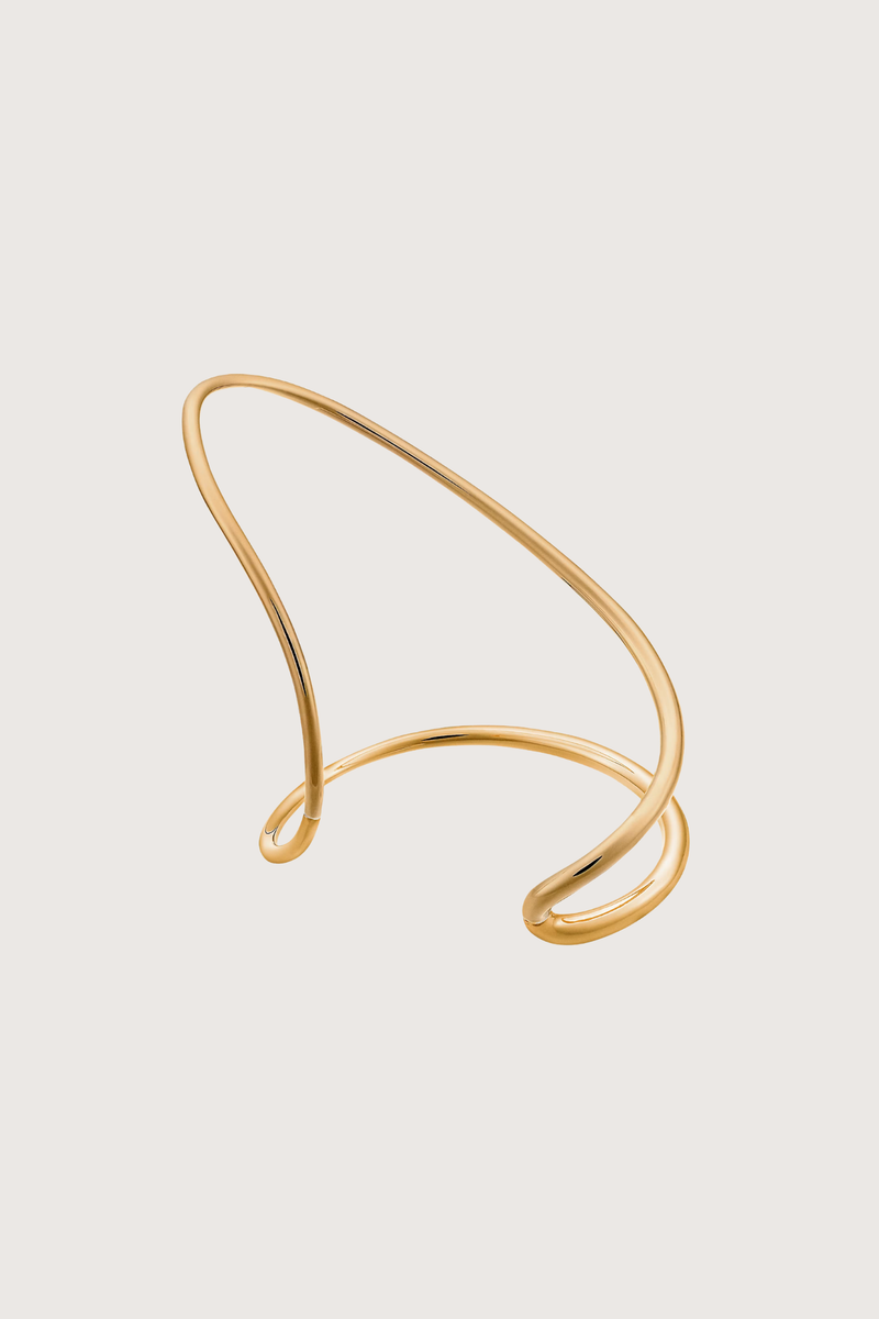 flat lay Ivy Left Bracelet Vermeil Jewelry that climbs and snakes, landing and curving around the body in unconventional ways
Fluid and supple
Yellow vermeil
18 karats