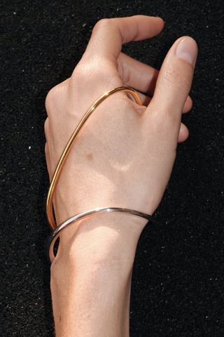 model wearing Ivy Left  Bracelet  Vermeil and Silver Yellow vermeil 18 karats and 925 Rhodium Plated Sterling Silver Jewelry that climbs and snakes, landing and curving around the body in unconventional ways