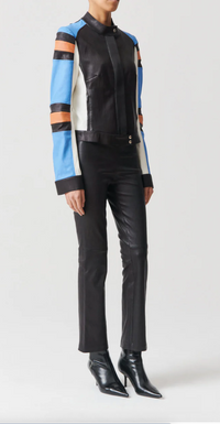 side profile model wearing JP Twenty Washable Leather Pant Noir kick flare elastic waist