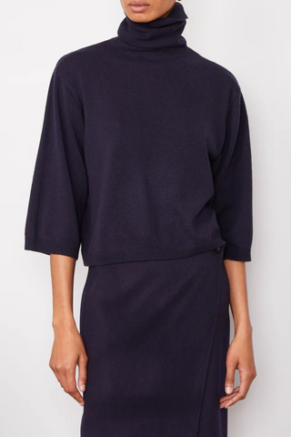 front profile model wearing Jalila Sweater Dark Navy boxy fit cashmere wool turtleneck with half sleeves