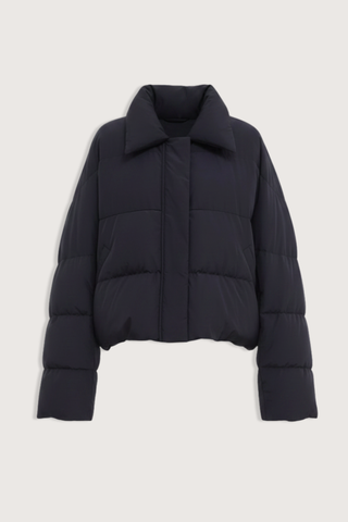 flat lay Jani Puffer Jacket Black Cropped signature down jacket
Soft water-repellent nylon
Oversized silhouette
Voluminous sleeves
Statement collar
Concealed snap buttons
Zip closure
Adjustable drawcord hem
100% Nylon
