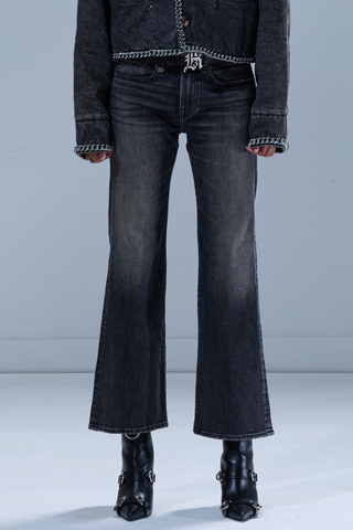 front profile model wearing Joan Kick Flare Jean Kenet Black relaxed fit vintage dark wash 