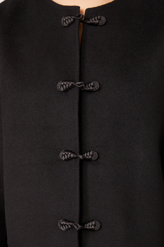 close up detail of Joella Double Face Split Jacket black
Straight fit
Cropped length
Round neck
Frog fastening
100% Wool
Shaped sleeve with dart and under-sleeve panel