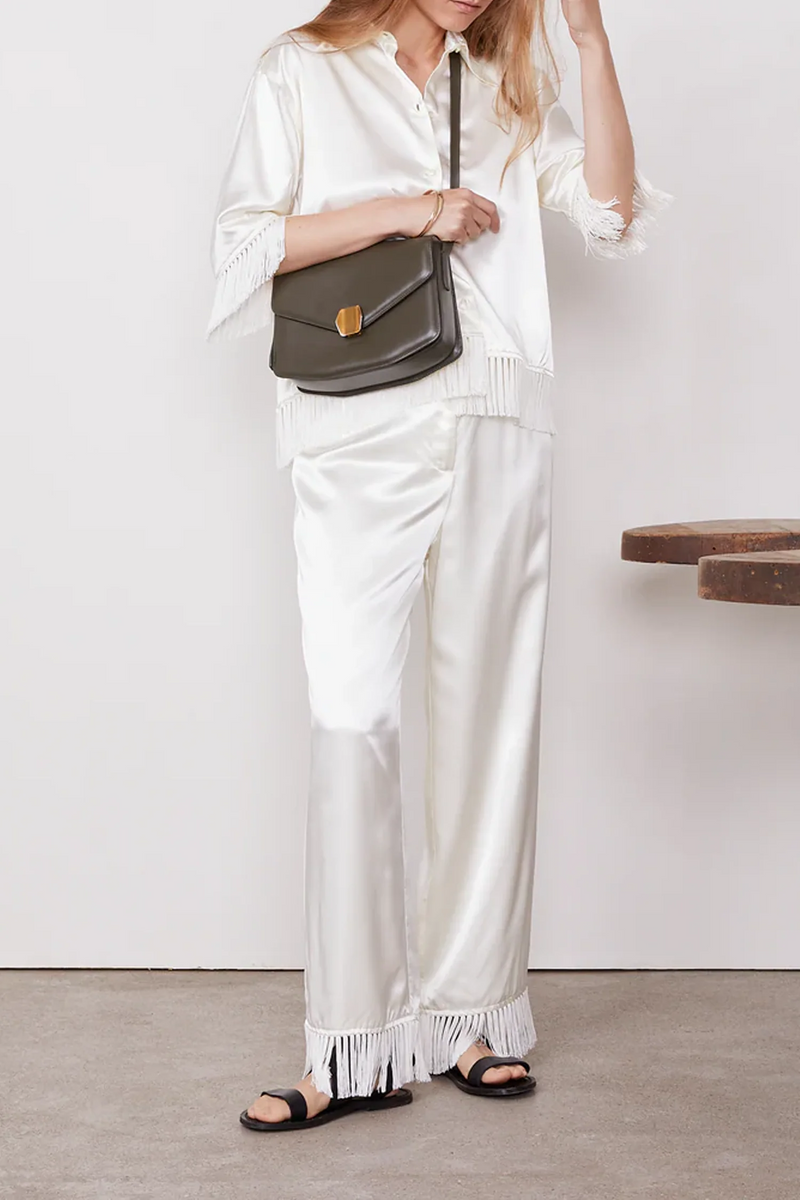 front profile model wearing olen Pants Fringe  hem Italian Viscose white