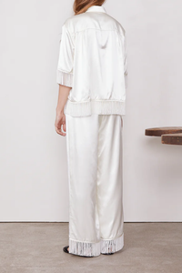 back profile model wearing olen Pants Fringe  hem Italian Viscose white