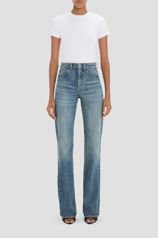 front profile model wearing Julia Stretch Straight Leg Jean worn blue mid wash cotton
High waisted
5 pocket styling
Leather patch
Belt loops
Button fly
Tobacco topstitching details
Branded hardware