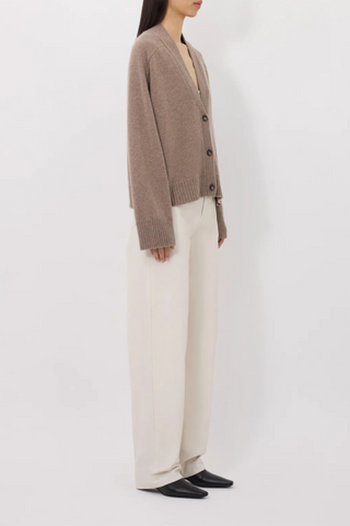 side profile model wearing Kaia Lds V-Neck Cashmere Cardigan taupe melange v-neck three front buttons