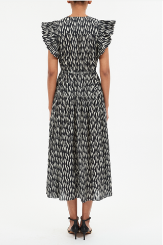 back profile model wearing Kairi Sleeveless Dress Batik floral print
Midi length
V-neckline with ties
Flutter sleeves