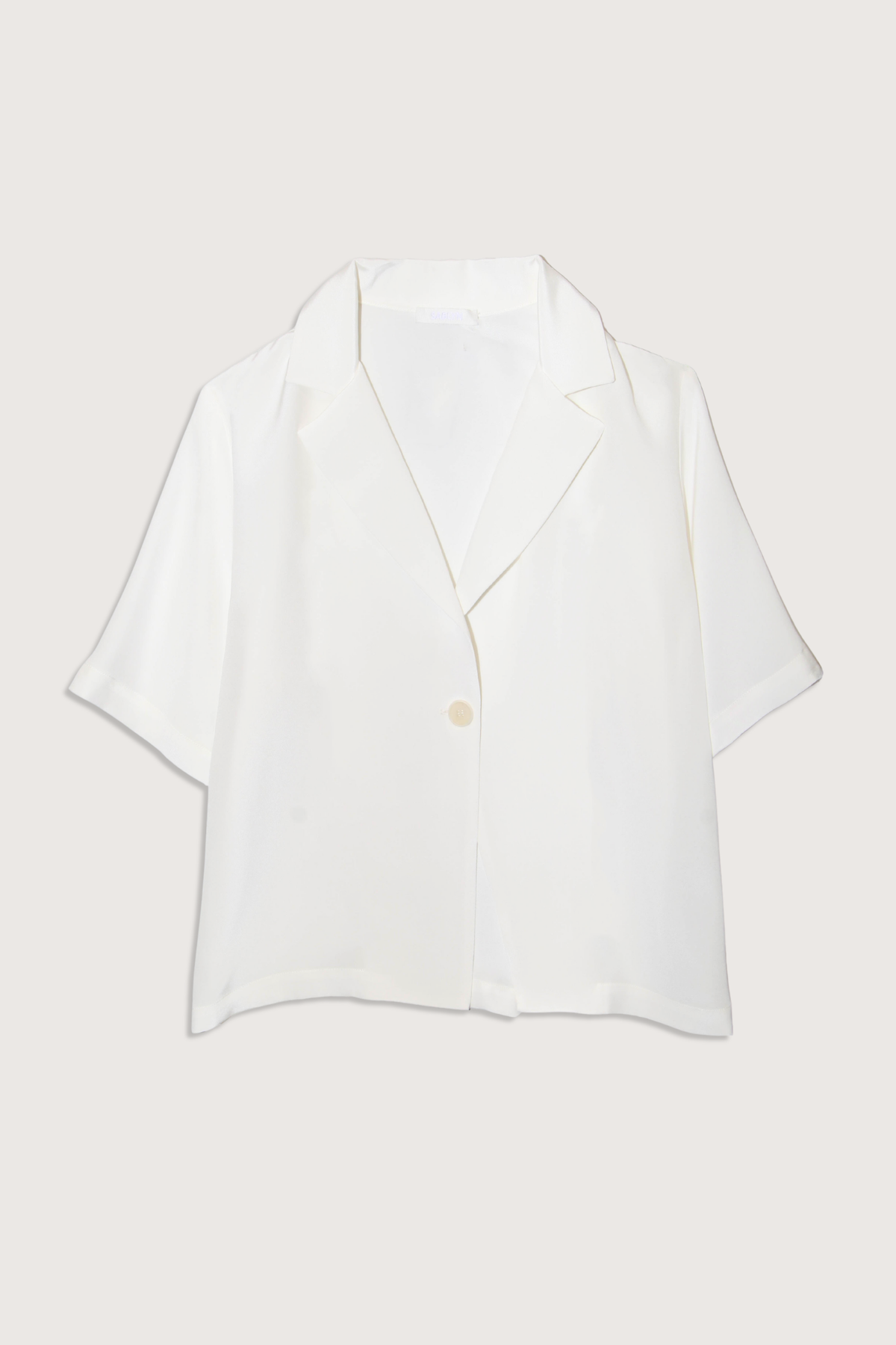 flat lay Kalleen Short Sleeve Collared Silk Top Single button closure
100% Silk