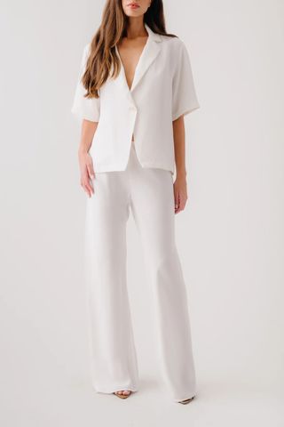 front profile model wearing Kalleen Short Sleeve Collared Silk Top Single button closure
100% Silk
