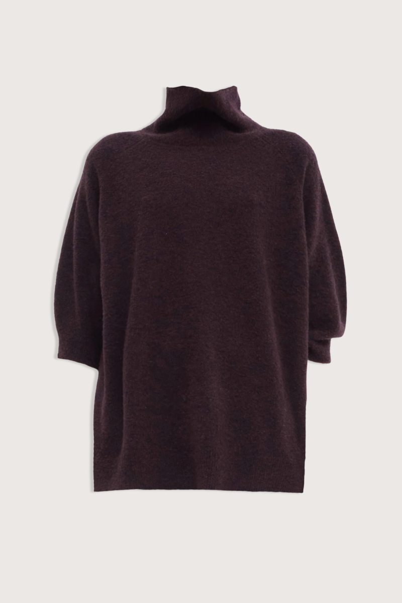 flat lay Kaluhu Short Sleeve Sweater Deep Plum Relaxed fit
Short-sleeve
Bouclé yarn
Soft rolled turtleneck
Dropped shoulders
70% Virgin Wool - 30% Polyamide