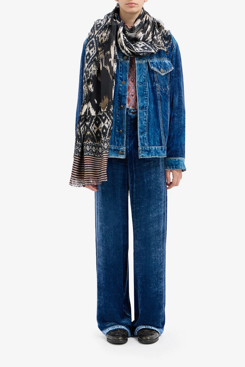 front profile model wearing Kankam Velvet Pants denim print effect wide straight leg blue