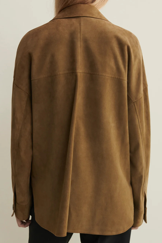 back profile model wearing Kaylee Lamb Suede Shirt Jacket Olive Designed for a relaxed, slightly oversized fit  front button closure two front flap pockets