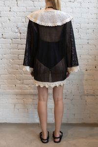back profile model wearing Kendall Crochet Cover Up black white Crochet
Two front ties
Scallop lace detailing
Contrast white crocket pocket design
Large sailor collar