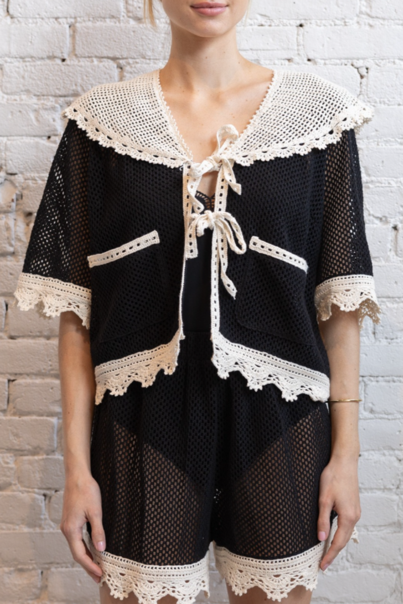 front profile model wearing Kendall Crochet Tie Top black and white Tie front Crochet white crocket trim
100% COTTON 