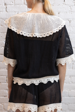 back profile model wearing Kendall Crochet Tie Top black and white Tie front Crochet white crocket trim
100% COTTON 